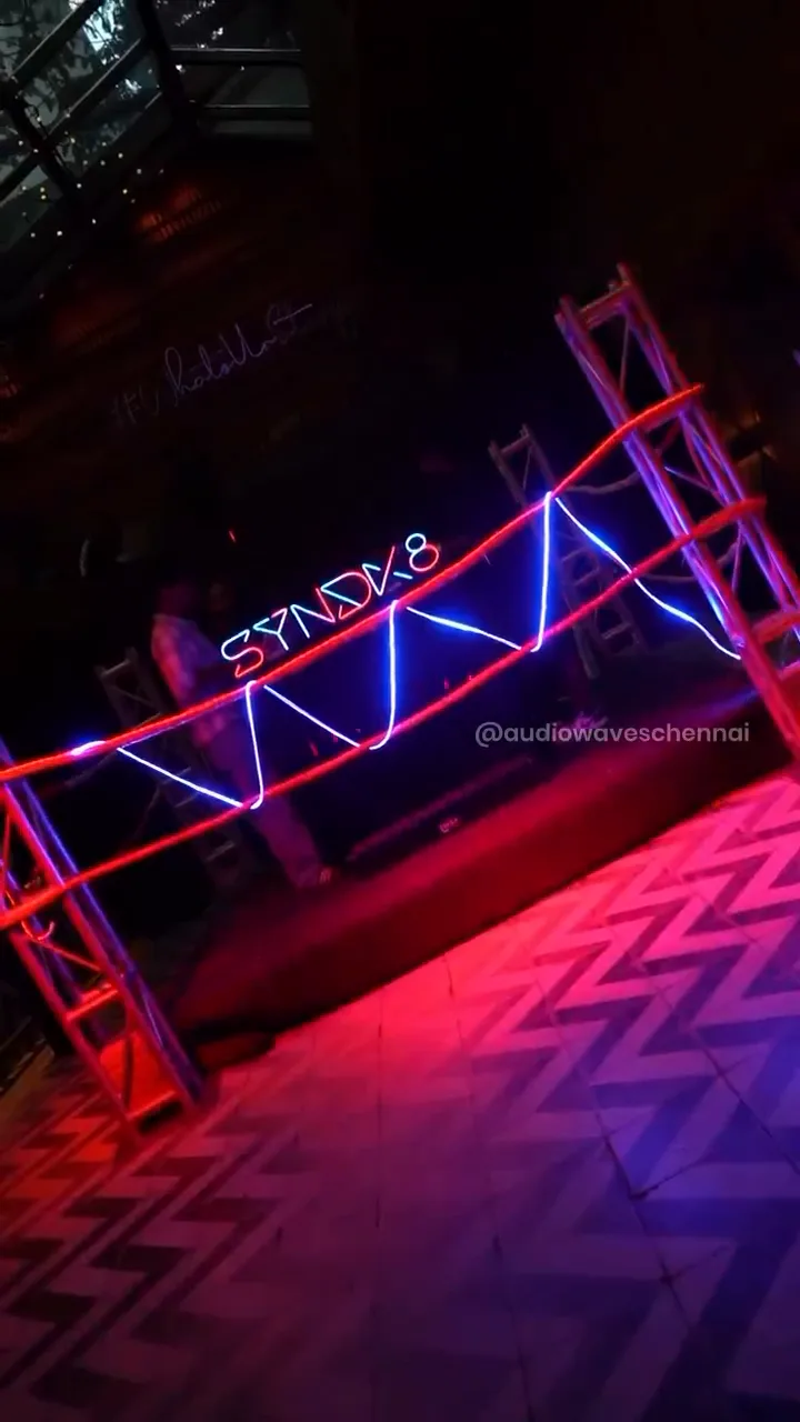Boxing-ring DJ arena lit in red and blue at Secret Story, Chennai