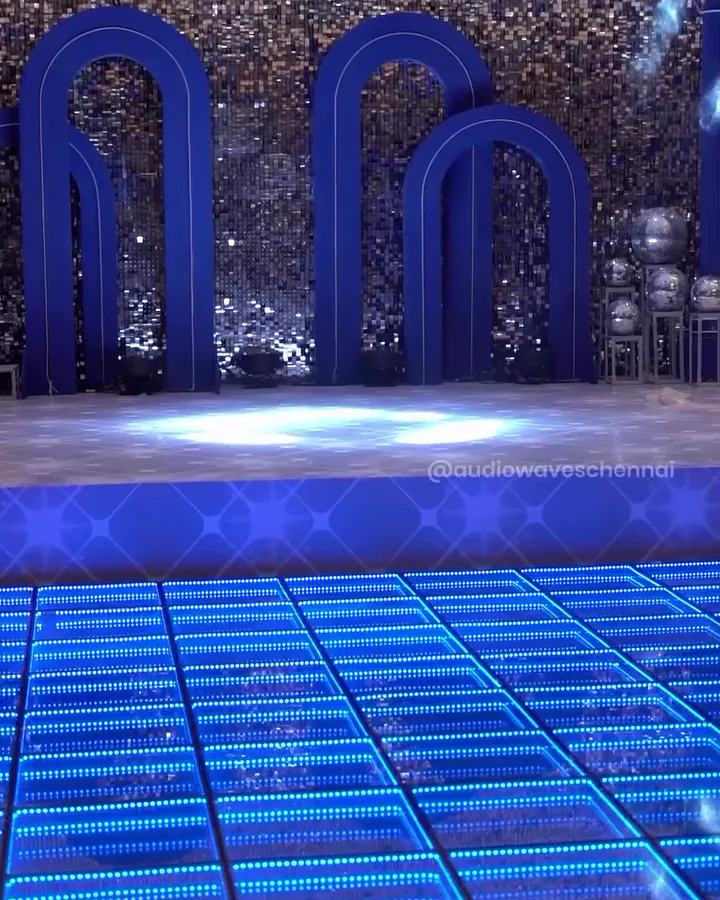 3D LED dance floor glowing blue in front of an arched stage backdrop